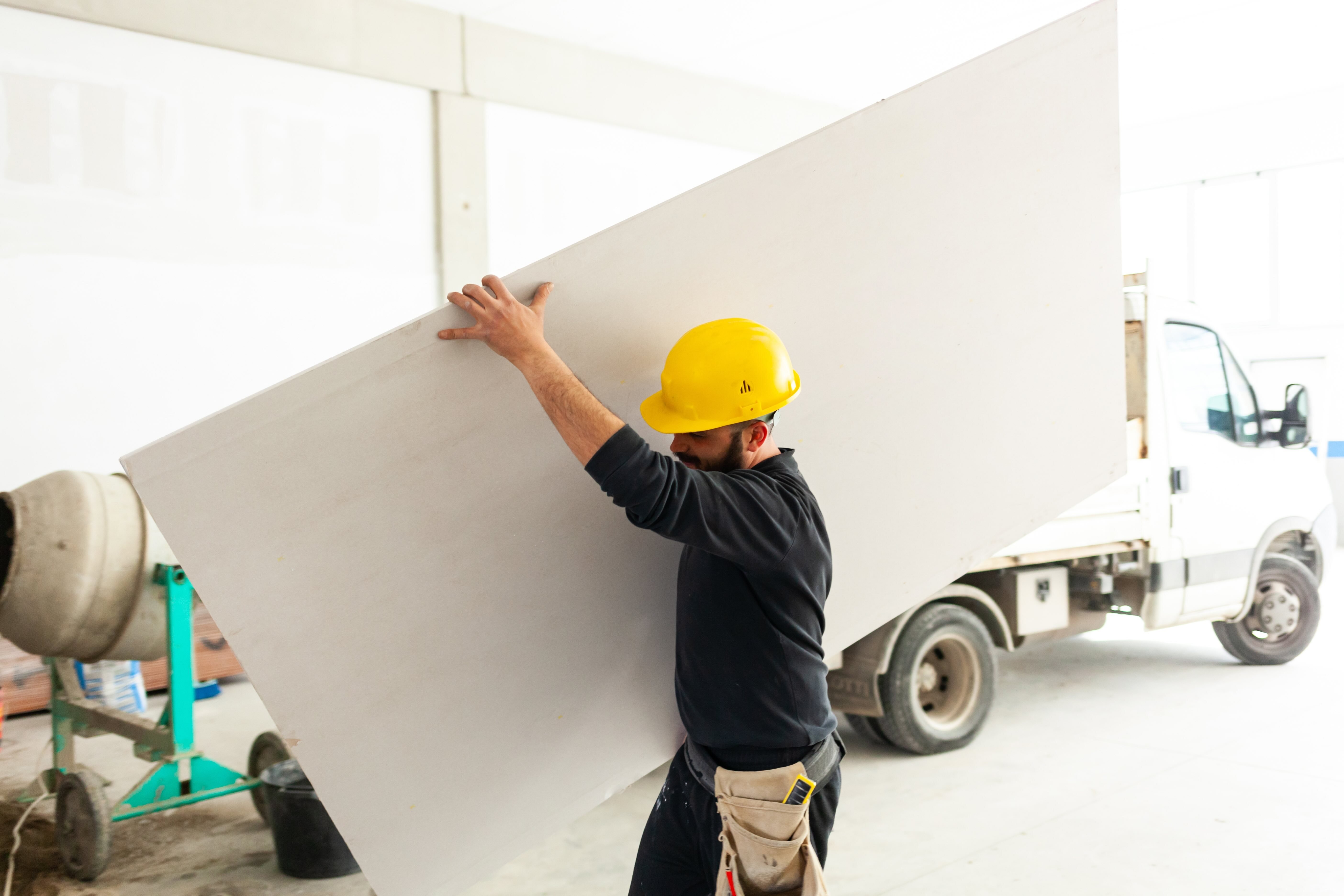 Worker_Building_A_Plasterboard_1mo
